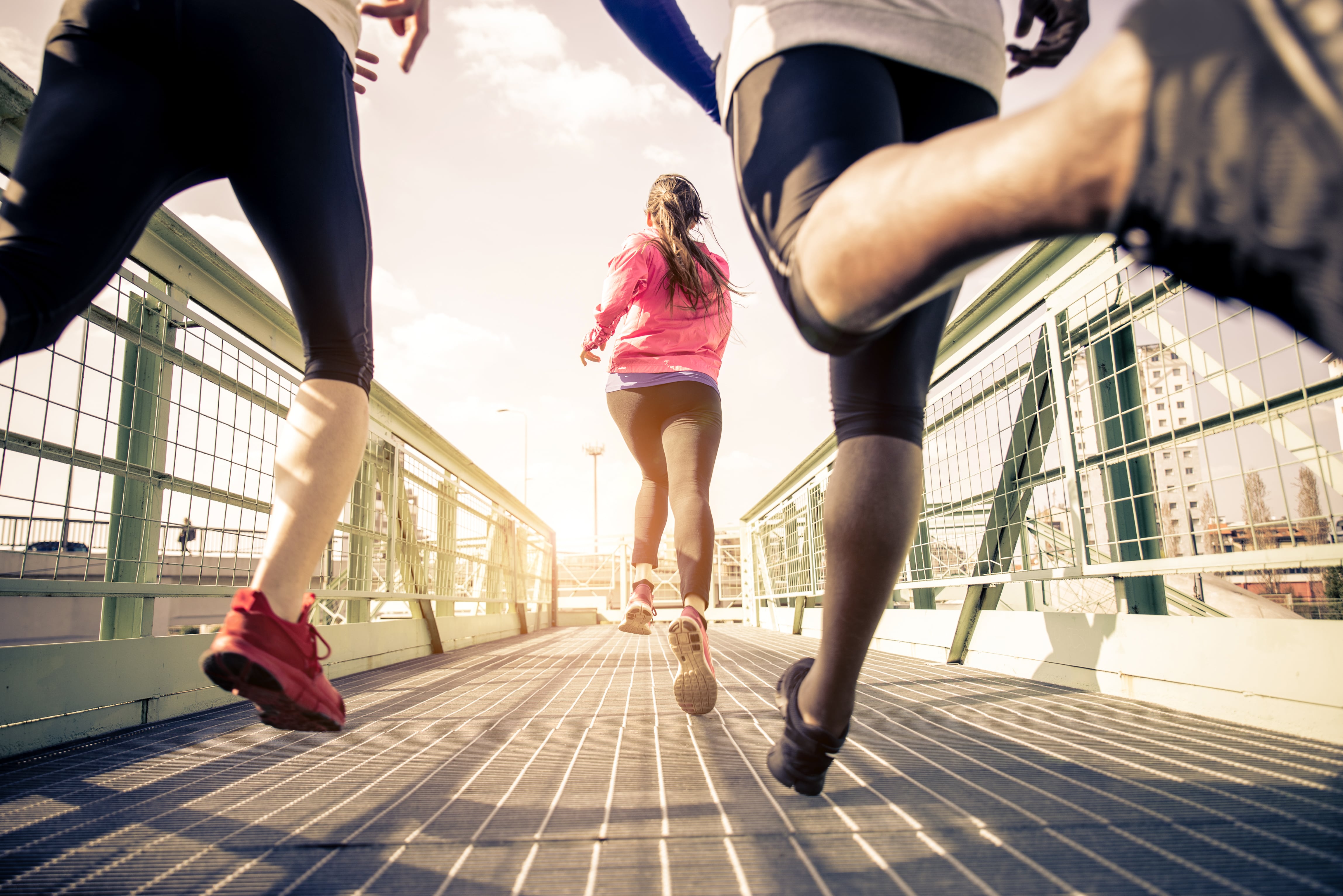 three runners sprinting outdoors, be healthy and active